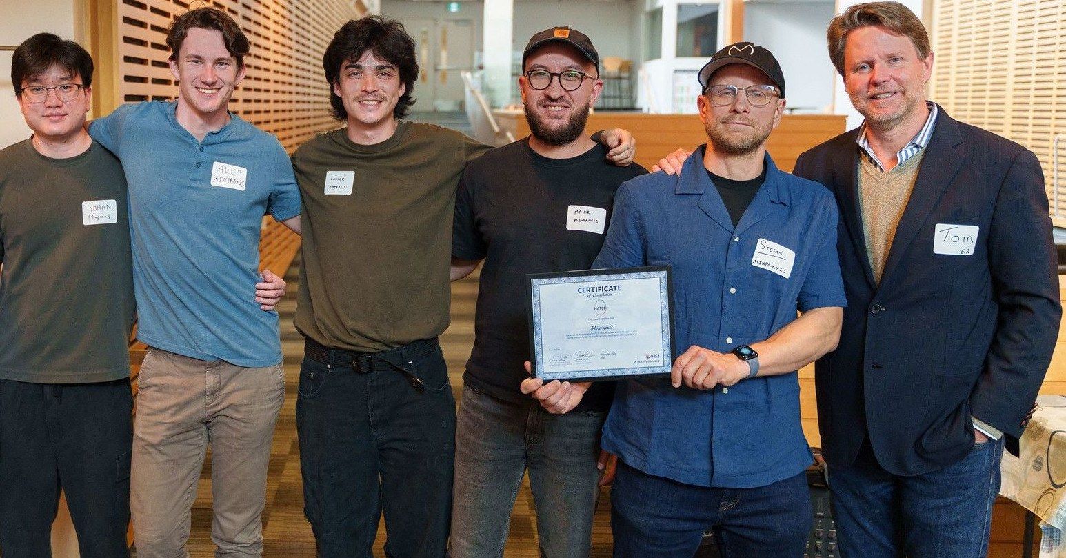 The Minpraxis team holding the HATCH certificate of completion at the graduation