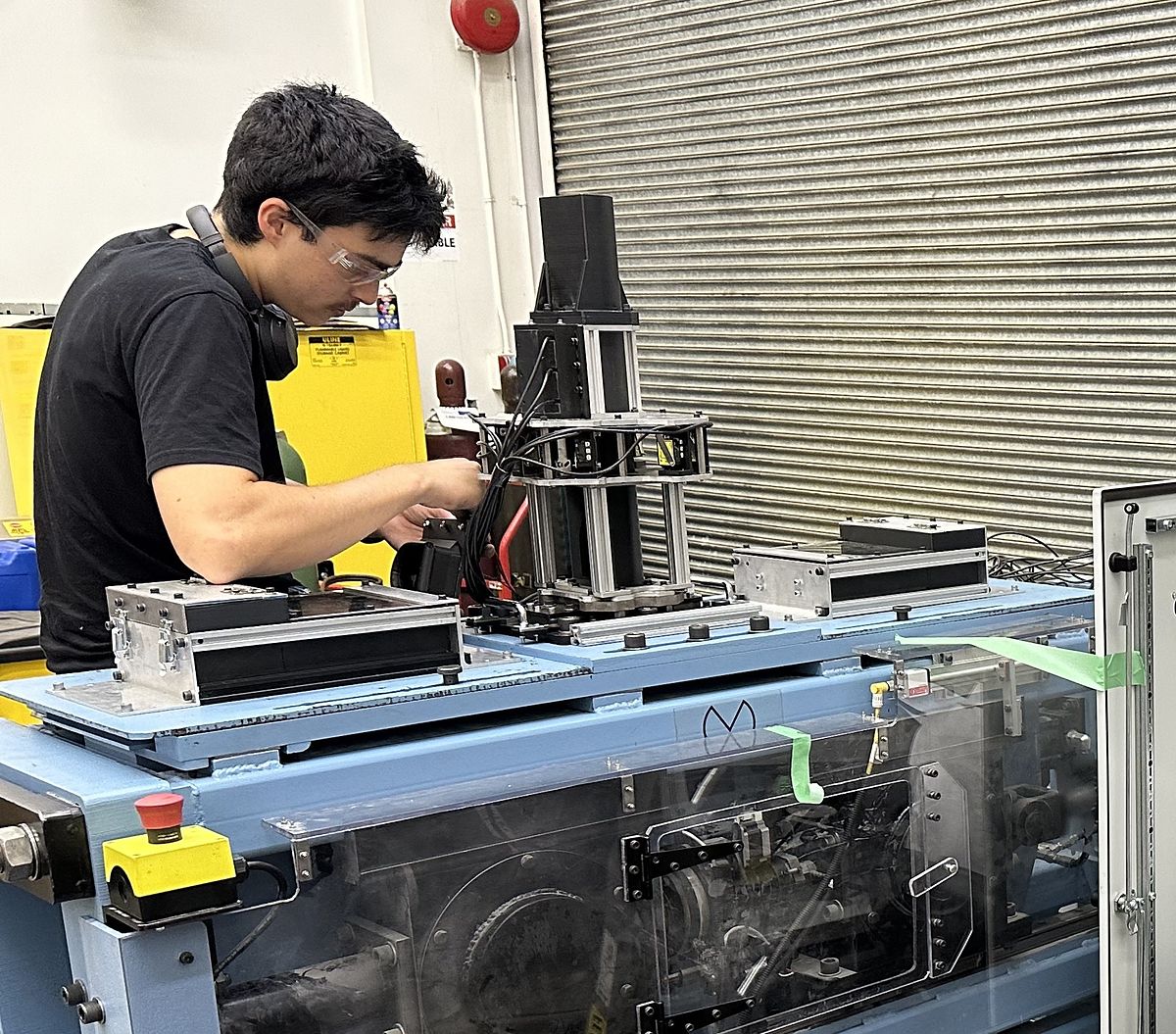 Minpraxis engineer working on a Minpraxis Tester in the workshop