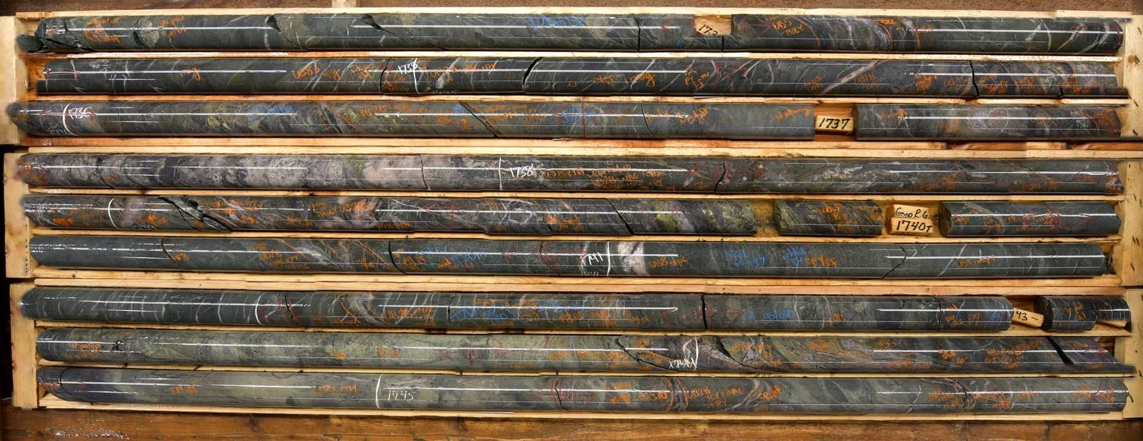 Drill core laid out in wooden core trays